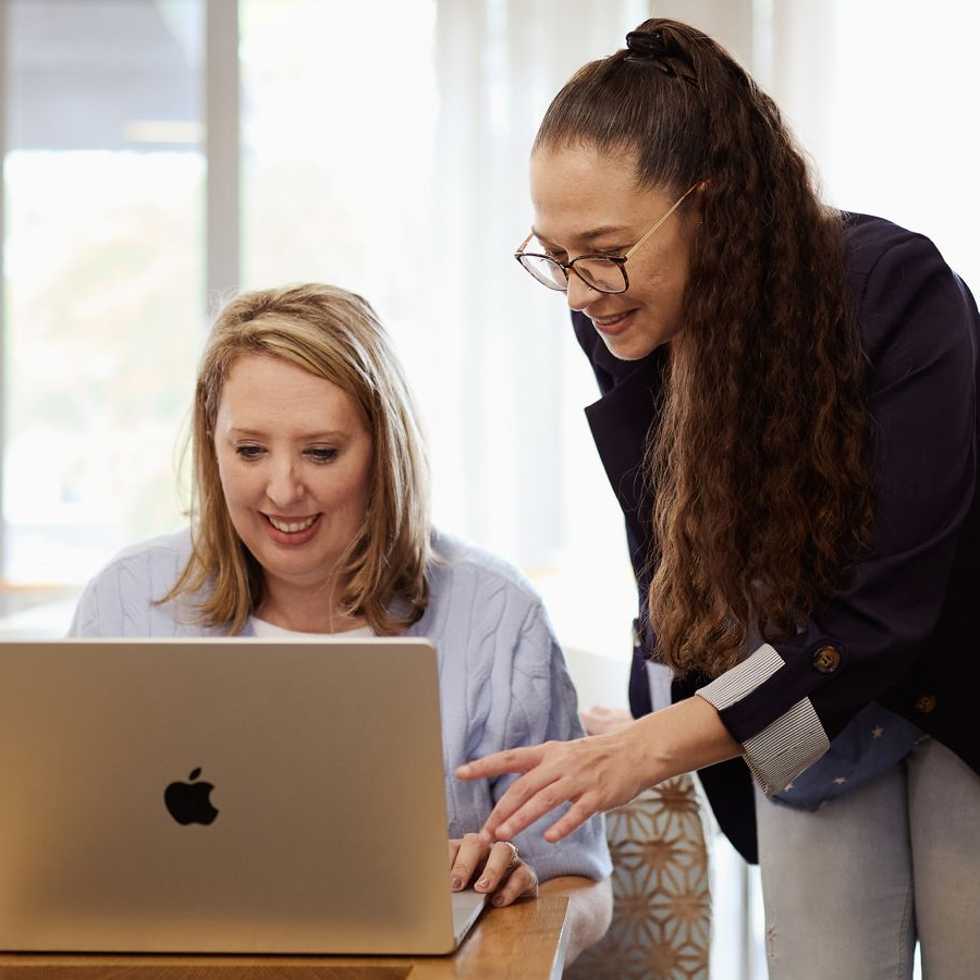 Two ladies looking at a laptop screen